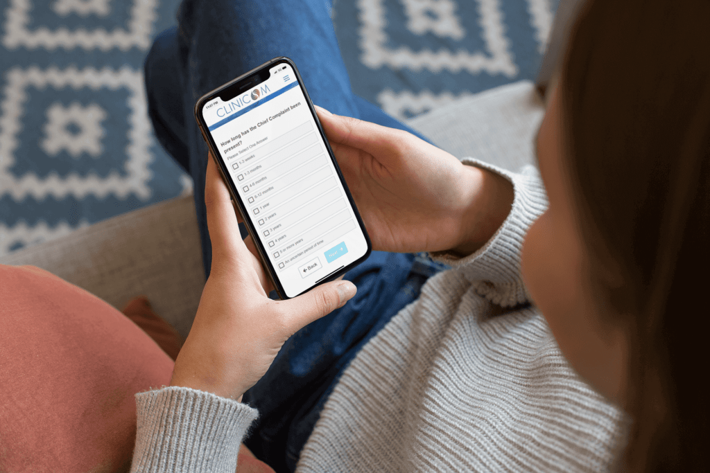 mockup-of-a-girl-sitting-on-a-couch-using-her-iphone-xs-25355